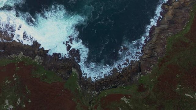Ocean Waves Crashing On The Rocky Coastline Of Beach