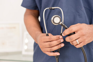 Close-up of a healthcare professional holding a stethoscope