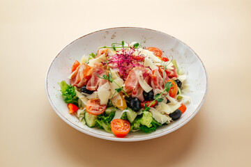 salad with Parma ham, herbs, tomatoes and Parmesan