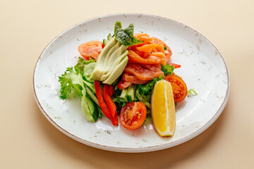 vegetable salad with avocado and red fish