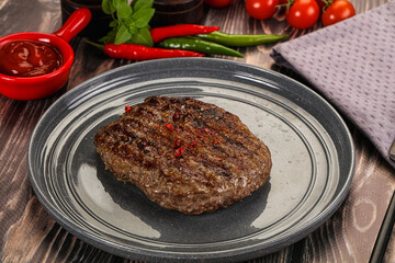 Grilled beef burger cutlet with sauce