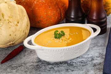 Vegan pumpkin cream soup served sesam