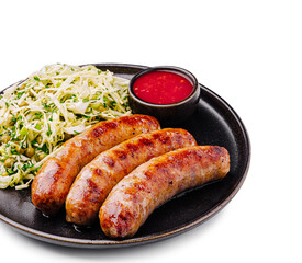 Grilled sausages served with shredded cabbage and dipping sauce