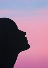 Silhouette of a woman's head and neck. the silhouette is black and is set against a pink and blue gradient background.