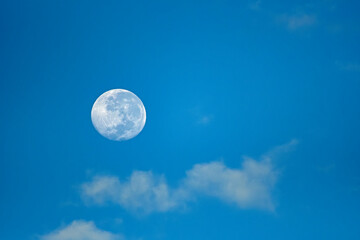 full moon in the morning sky
