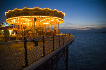 Brighton Pier at sunset, merry go round, fairground © Kay Ransom