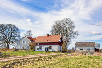 Gravel road to a farm at springtime in the countryside