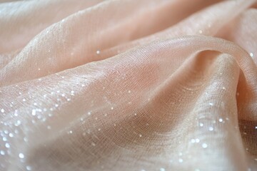 Fototapeta premium Soft Peach Fabric with Sparkling Textures in Natural Light
