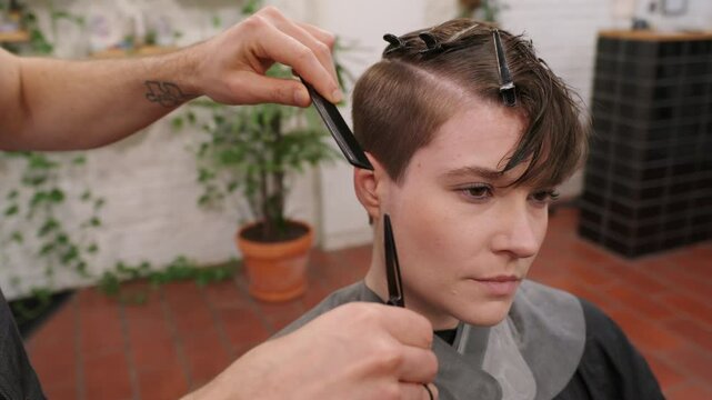 Hairdresser cutting hair in slow motion