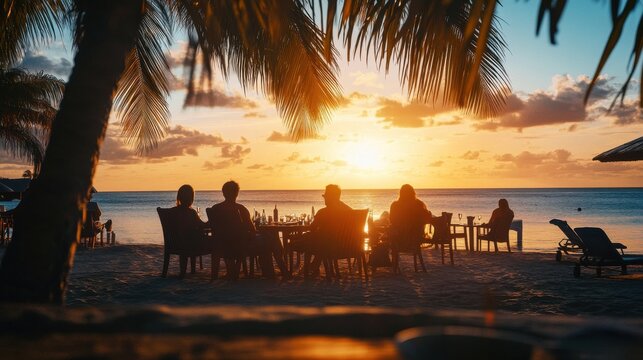 Guests enjoying a sunset cocktail at a beach resort on a tropical island.