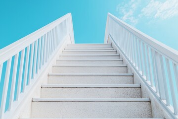 Fototapeta premium Beginning journey concept. Staircase leading upward against a bright blue sky background.