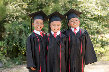 Three young graduates celebrate their big achievement together