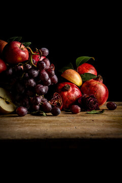 Still life with fruits and black background