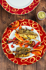 Grilled fish on skewers, pollock.