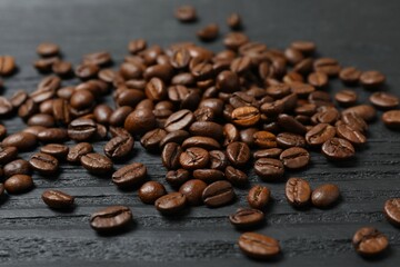 Fresh coffee beans on wooden background