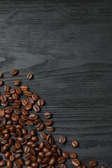 Fresh coffee beans on wooden background
