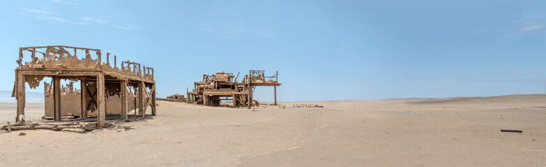 run-down Drill Rig relic on desert sand, Old oil Rig site, Skeleton coast, Namibia
