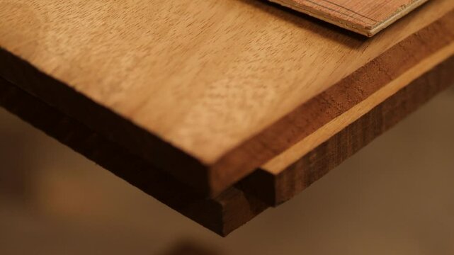 Planed Iroko wood planks stacked