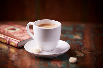 Cup of coffee on wooden background. Soft focus. Copy space
