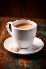 Cup of coffee on wooden background. Soft focus. Copy space