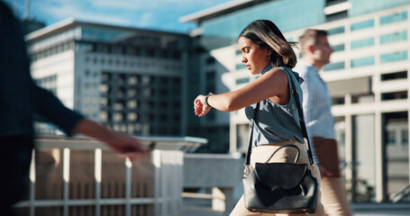 Business. check time and woman in city, travel and late with commute, urban town and stress. People, outdoor and employee with watch, walking and morning with schedule, agenda and lady in New York