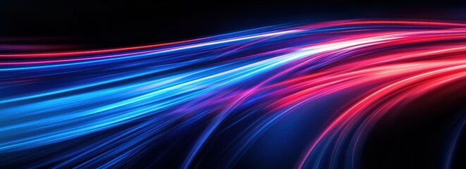 Abstract red and blue light streaks on black background.