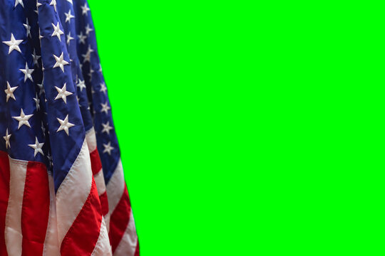 Close-up of the American flag with stars and stripes against a green background for video. - Powered by Adobe