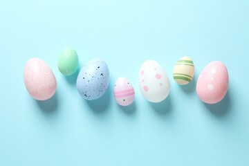 Flat lay composition with Easter eggs on color background