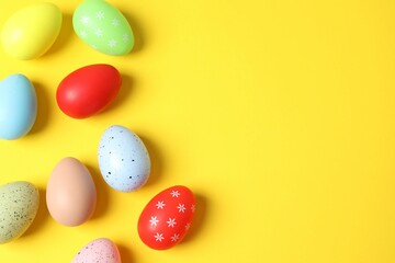 Flat lay composition with Easter eggs on color background