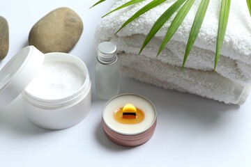 Composition with symbolic objects for spa salon. Stone therapy attributes for cosmetic procedures. Conceptual image, rocks and candle representing balance. Close up, copy space, top view, background