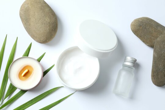 Composition with symbolic objects for spa salon. Stone therapy attributes for cosmetic procedures. Conceptual image, rocks and candle representing balance. Close up, copy space, top view, background