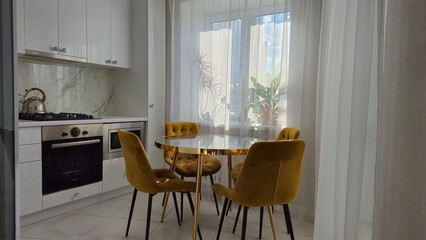 Marble table and yellow chairs in the interior