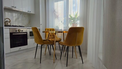 Marble table and yellow chairs in the interior