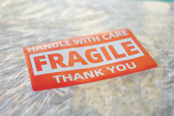 Careful handling required for fragile package during delivery