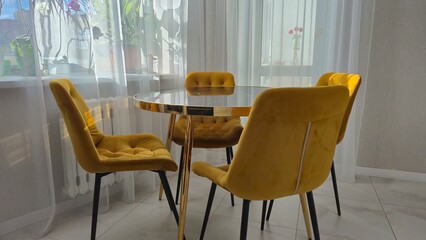 Marble table and yellow chairs in the interior
