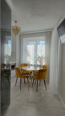 Marble table and yellow chairs in the interior