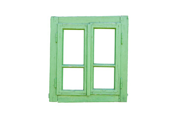 Obraz premium Old wooden window painted green, slightly tilted to the right, featuring four isolated panes, evoking a rustic and weathered charm.
