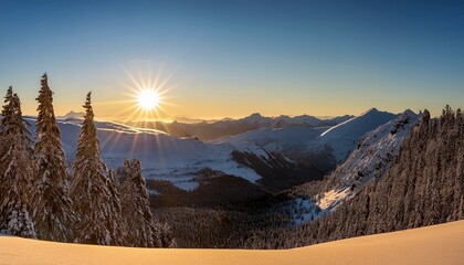 A bright winter sunrise over a vast snowy mountain range, casting long shadows across the white expanse of snow.