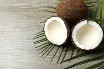 Coconut on wooden background, top view