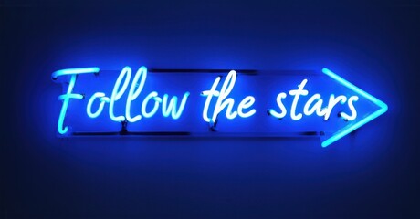 Neon sign with follow the stars, featuring a neon night sky and a cosmic arrow, creating a celestial and inspiring atmosphere with bright, colorful, and glowing illumination