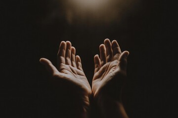 Two hands reach upward against a dark backdrop, seeking connection or offering prayer. The gentle ambiance evokes a sense of hope and yearning in twilight