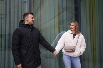 Romantic couple in love holding hands