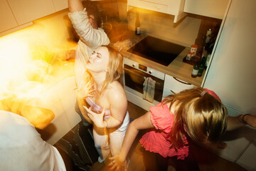 High angle view of friends enjoying party at home