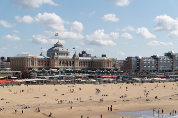 The Hague, Holland-July 26 2023: Grand Hotel Amrâth Kurhaus with tourists, Scheveningen. View of the hotel from sea.
