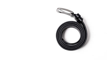Black leather belt with matte metal buckle close-up isolated on white background. Fashionable unisex accessory for trousers, jeans, dress. Luxury male strap for man and woman. Haberdashery goods.
