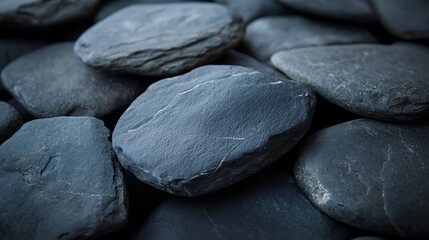 Close-up of smooth, dark gray stones evoking tranquility and balance