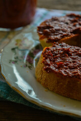 Ajvar - Traditional homemade spread made from red peppers, typically prepared in Balkan countries. Vertical photo. 