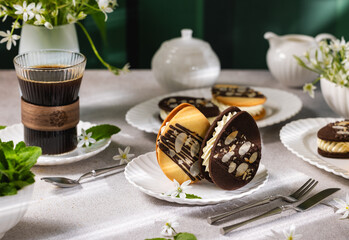 Delicious homemade cookies with cream filling and almonds for dessert or breakfast