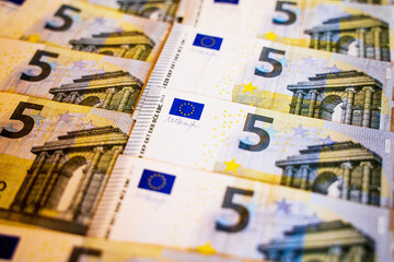 euro money bills lie on the table a lot of money a large amount of banknotes of five and twenty...