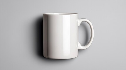 Fototapeta premium Clean Minimalist White Coffee Mug Mockup on Gray Background Ideal for Branding and Design Projects